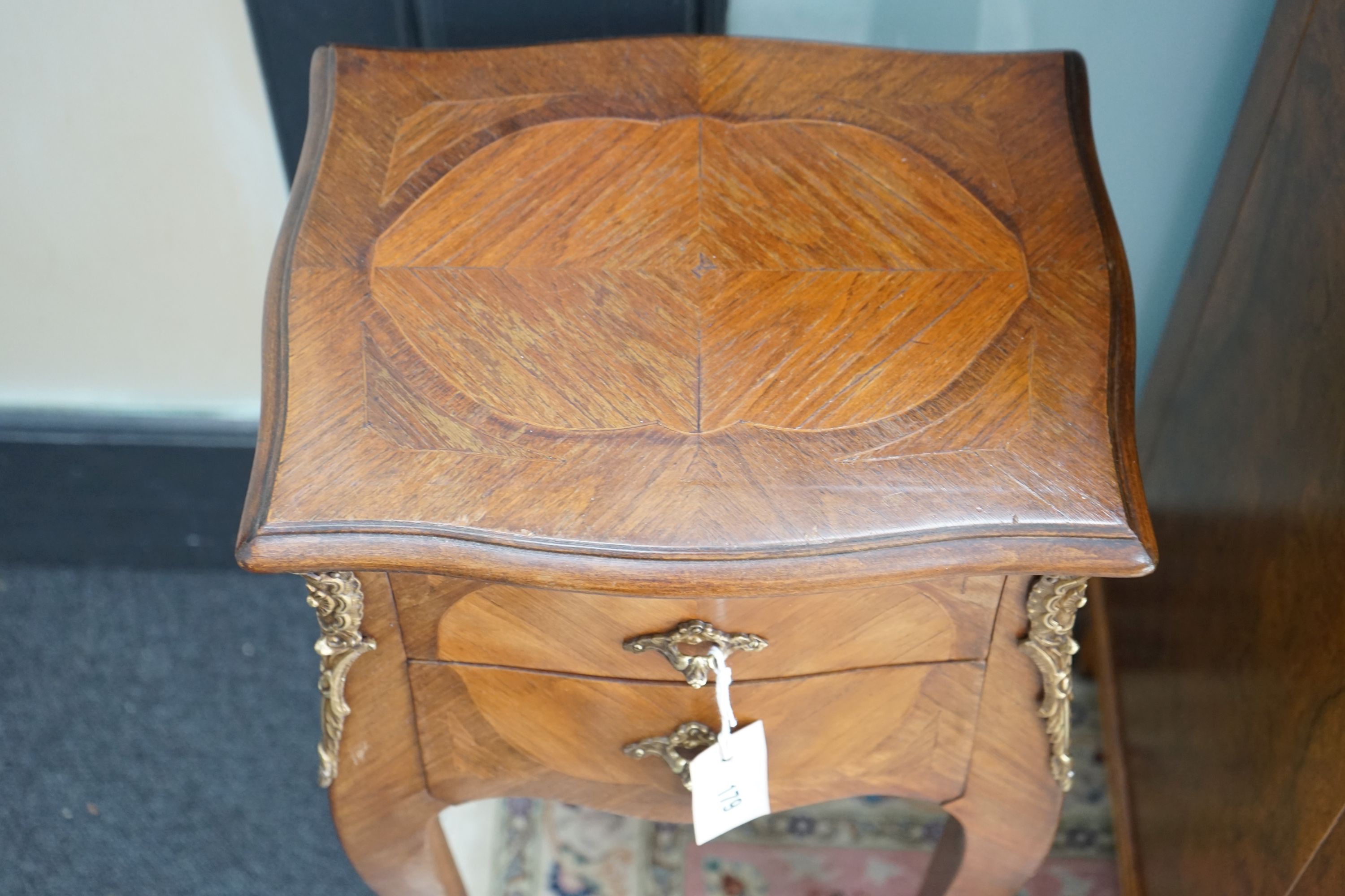 A pair of Louis XVI style serpentine kingwood two drawer bedside chests, width 34cm, depth 26cm, height 78cm